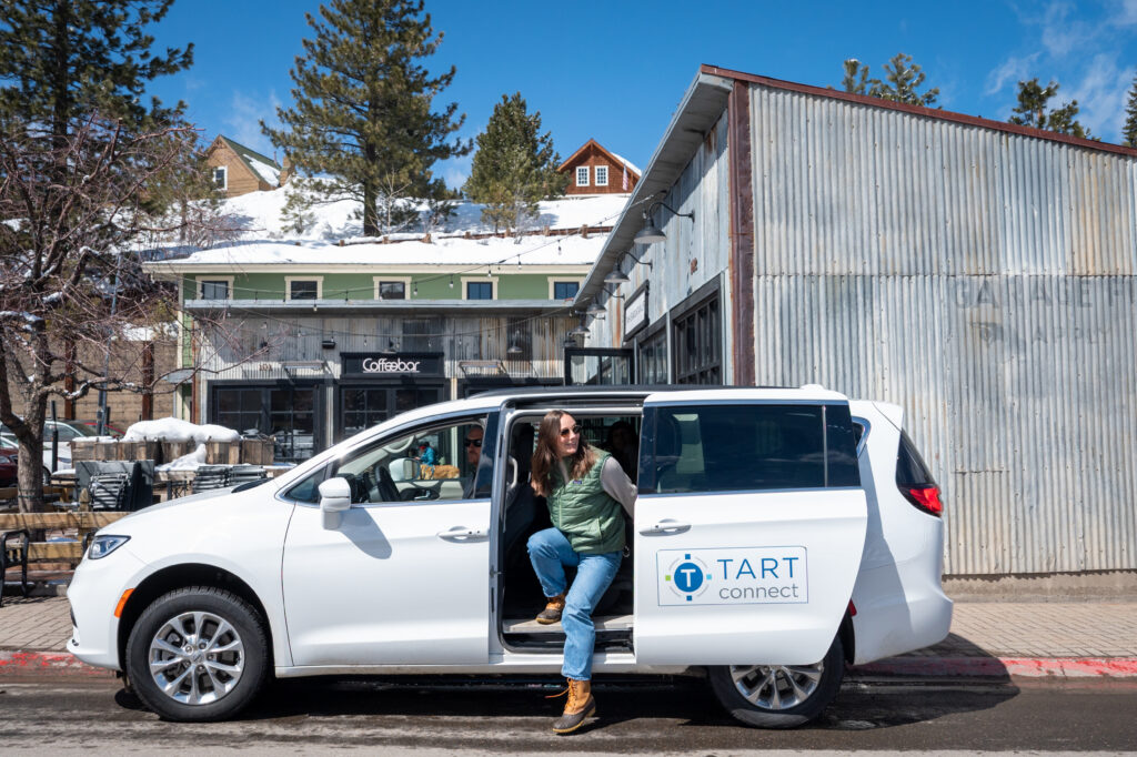 rider getting out of TART connect minivan in downtown Truckee
